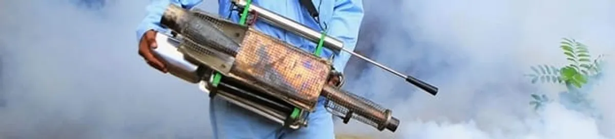Fumigation technician using a fogger for deep pest treatment in Fort Wayne, IN